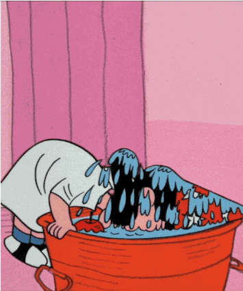 a gif of Lucy from Charlie Brown bobbing for apples